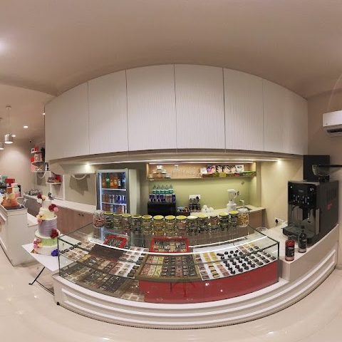 Inside the patisserie, the cake counter