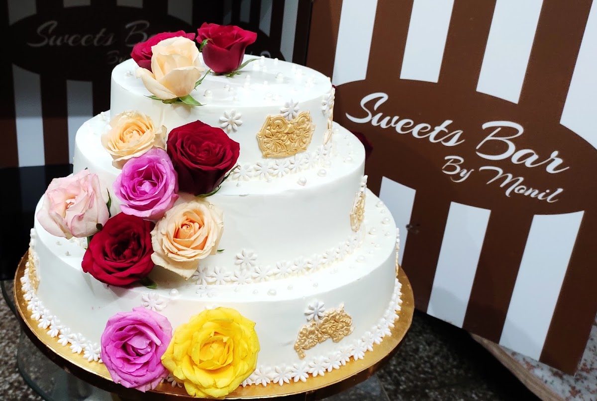 Three tier wedding cake with roses