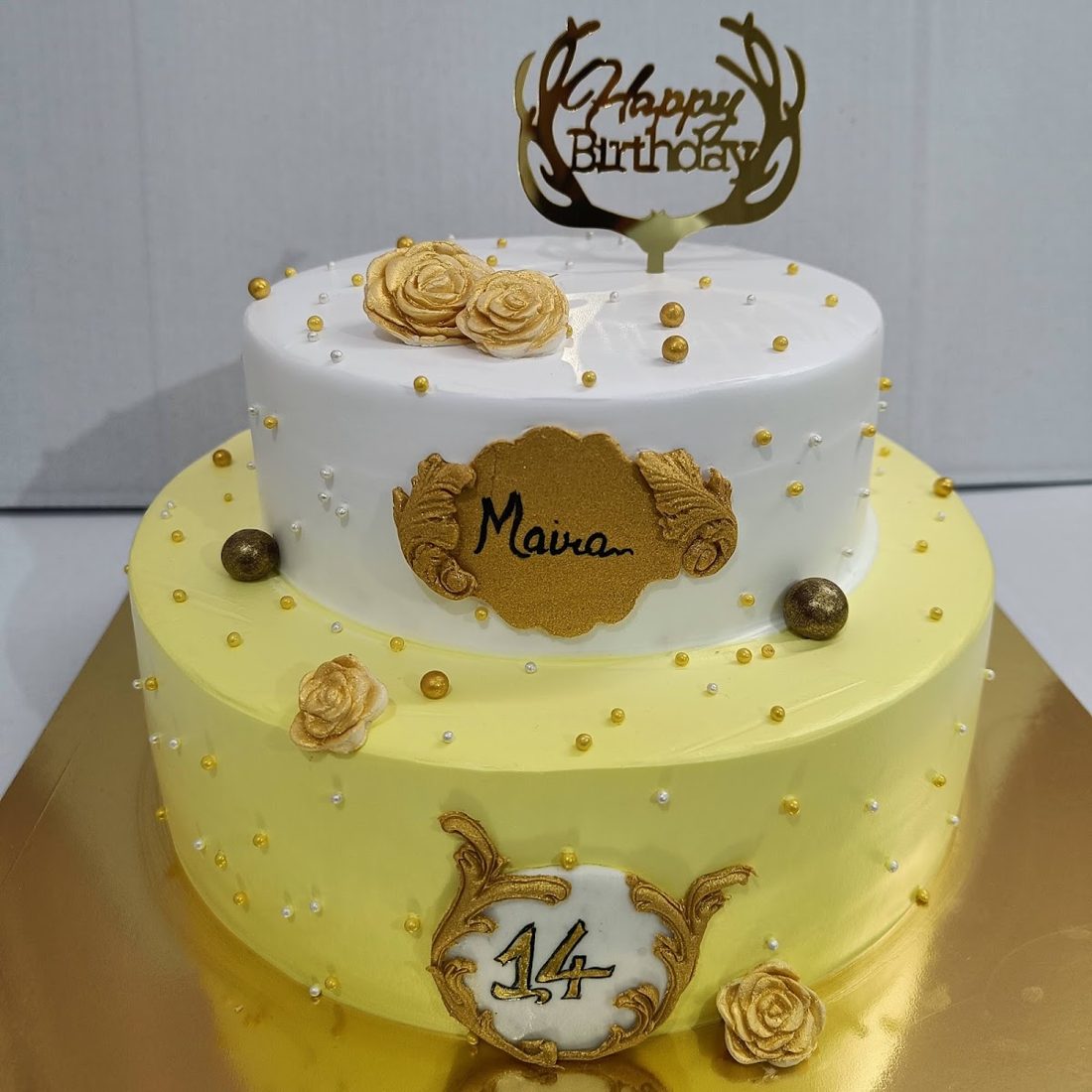 Two tier kids birthday cake with name plaque